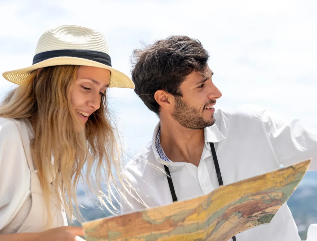 Tourists consulting a map during a visit to Venice—an area easily accessible from the Titian Inn Hotel Venice Airport